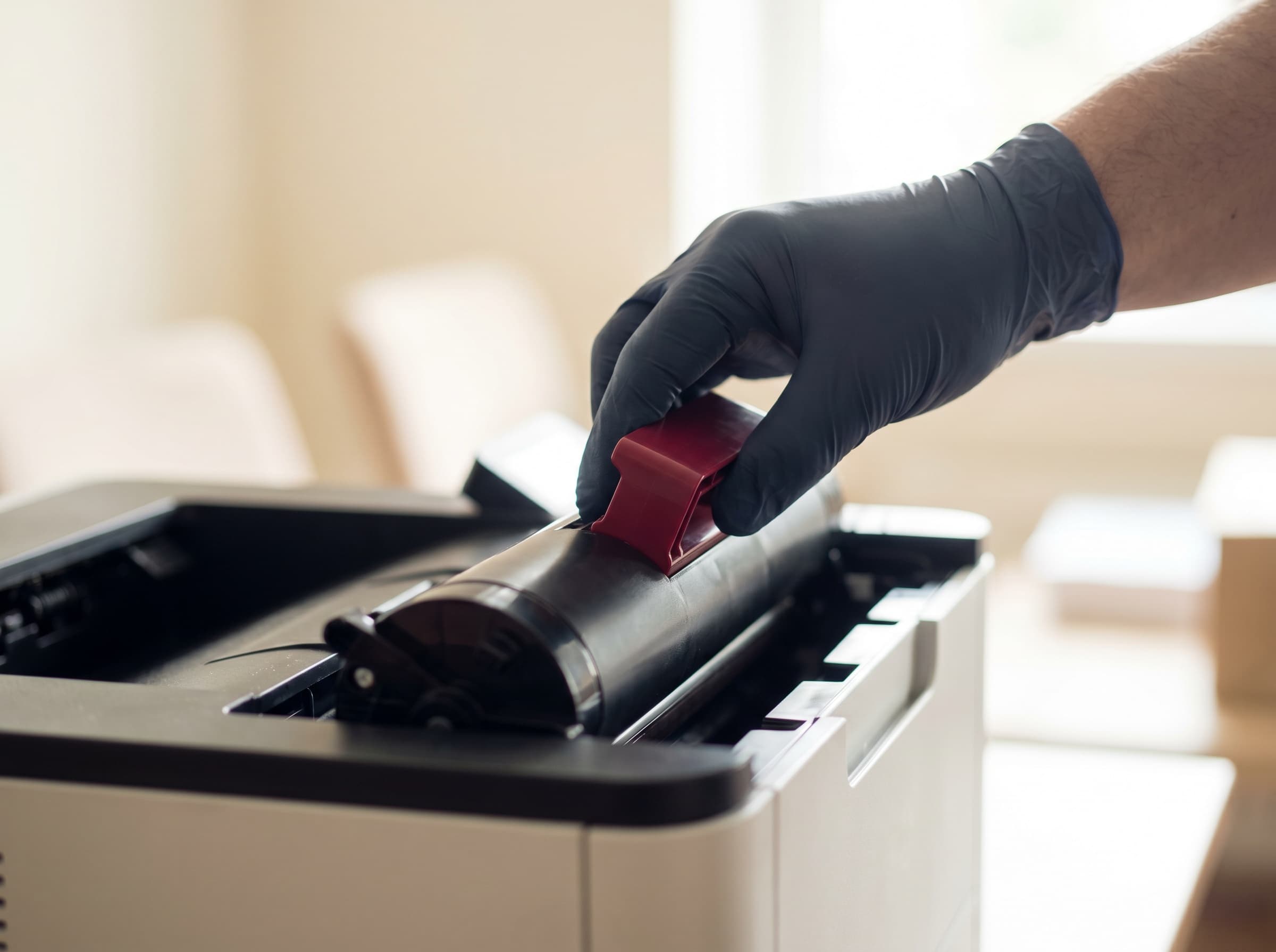 Technician installing a genuine Toshiba drum unit into an office printer