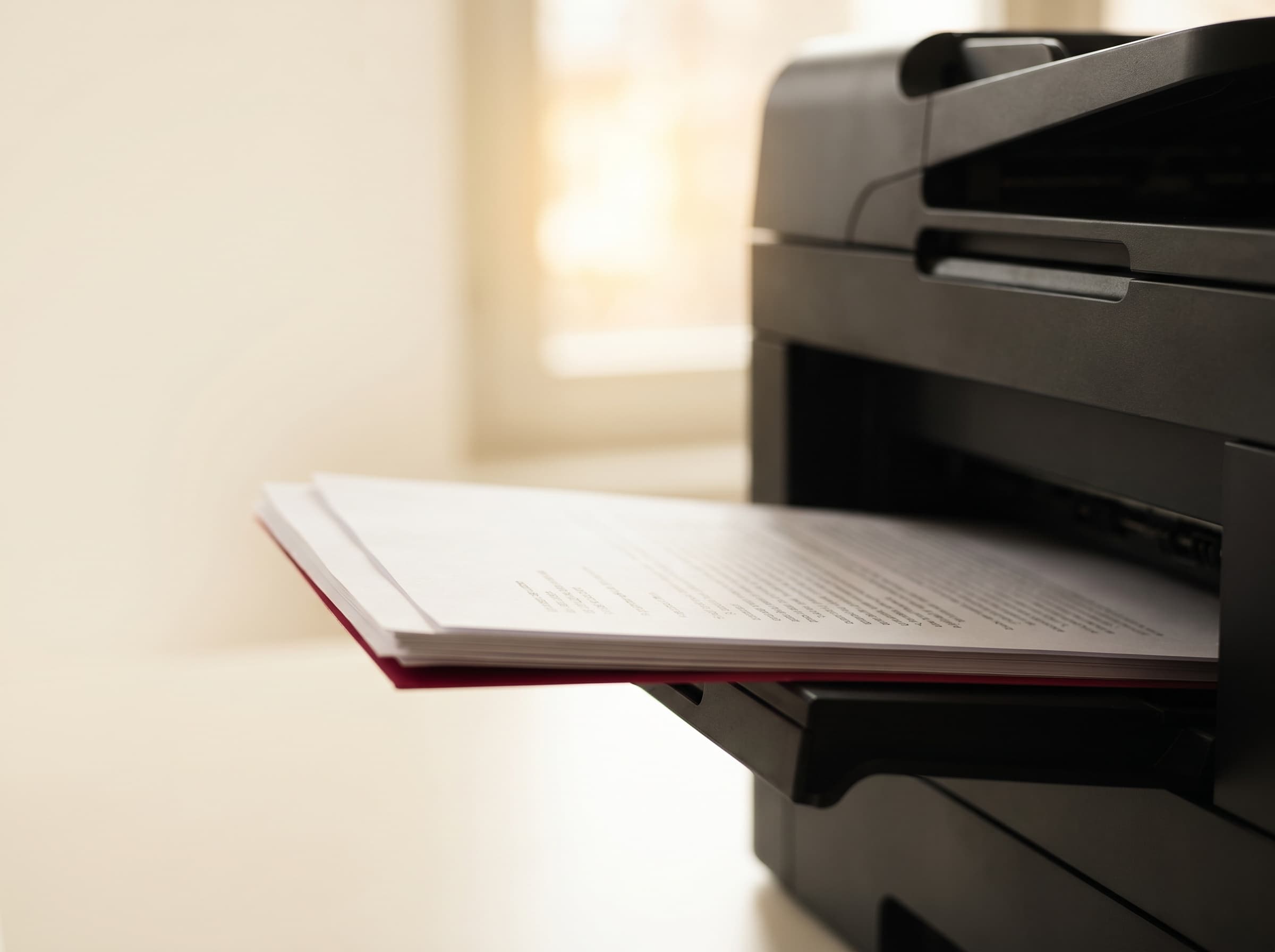 A user releasing a secure print job at a Toshiba multifunction printer with a PIN